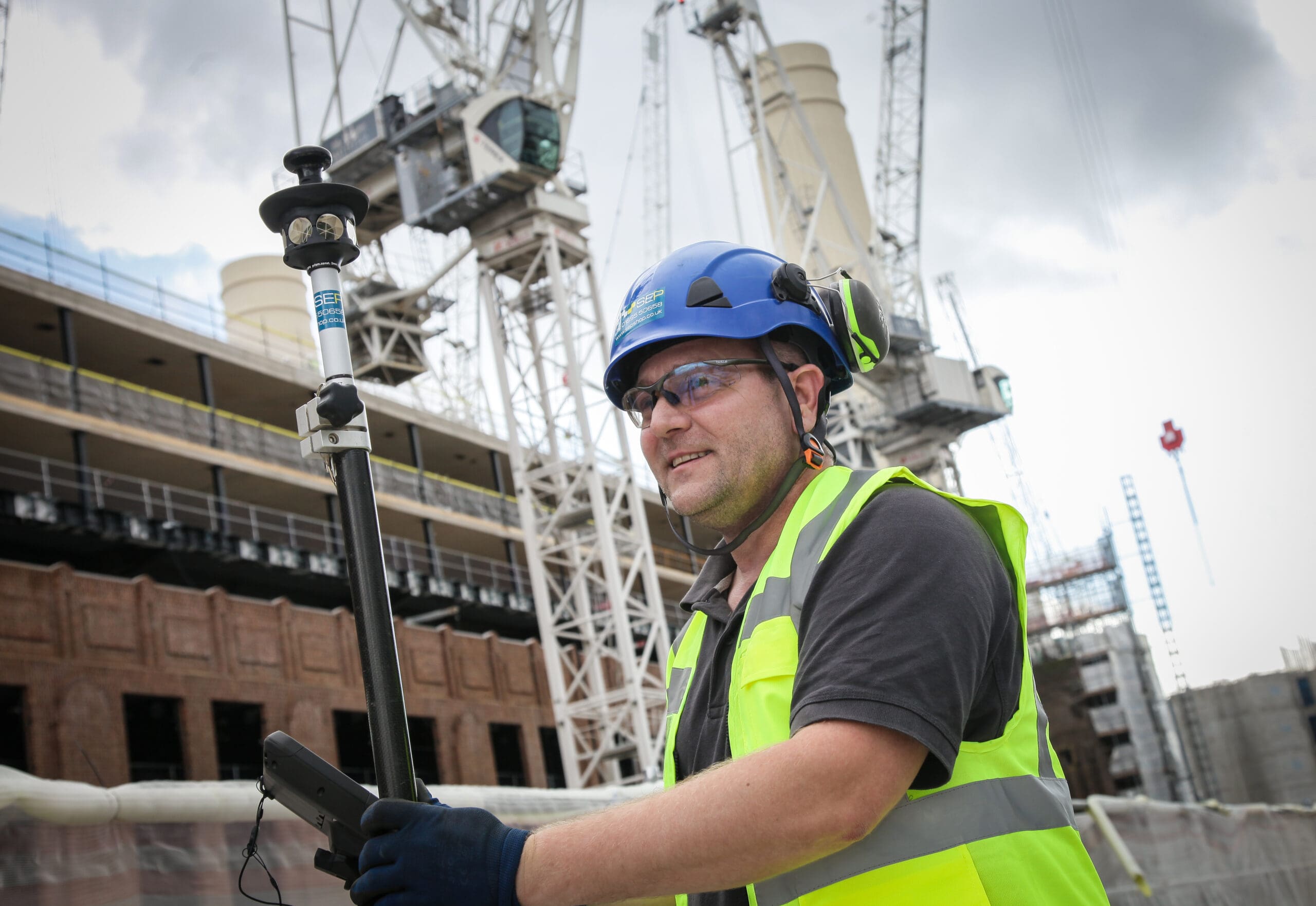 Setting out engineer working on site in Fulham